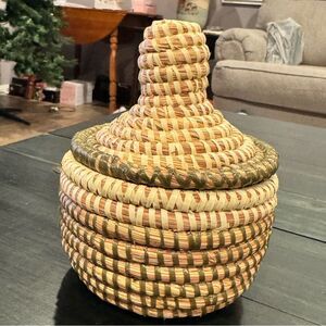 Handwoven sweetgrass coiled basket with a fitted lid
